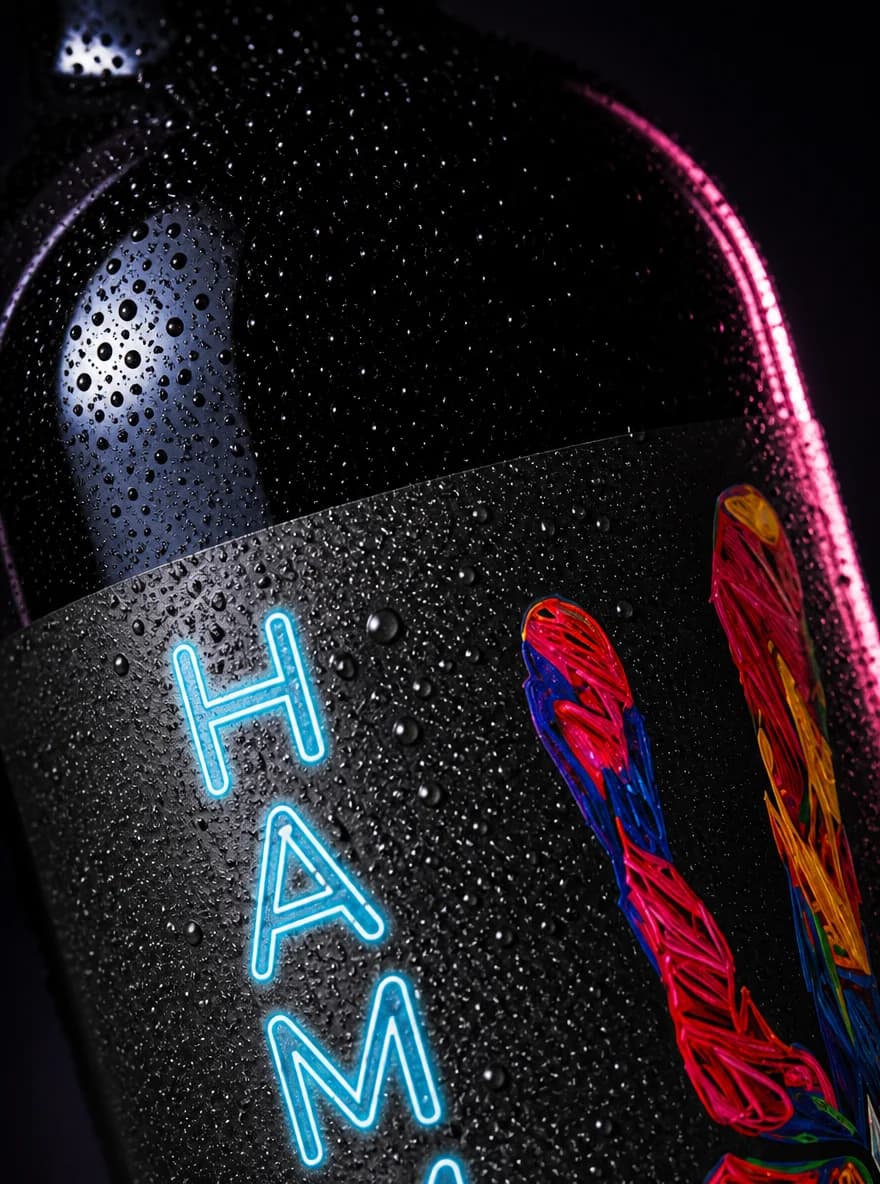 Close-up of the Hammer bottle label and colorful hand illustration
